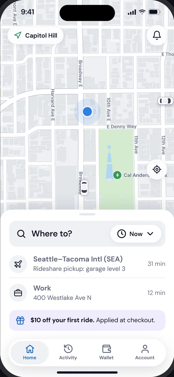 VoziNow home screen with a Seattle map and a Where to? search with saved places